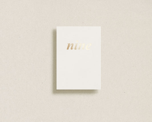 'nine' gold foil greeting card