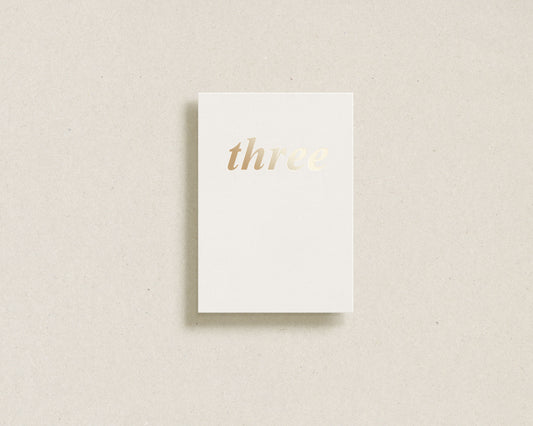'three' gold foil greeting card